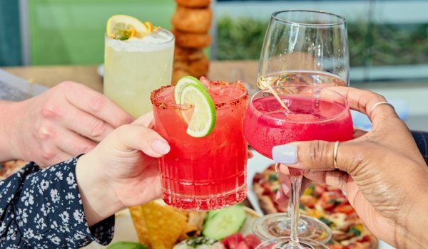 People holding up drinks